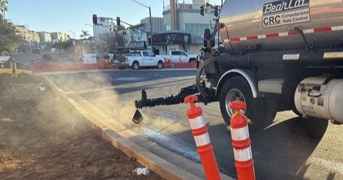 Construction along Grand Avenue: Cement truck preparing to lay concrete.