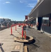 Construction along Grand Avenue: Sidewalk paving