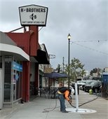 Crews continue sandblasting around tree rings. 