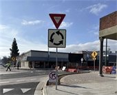New roundabout completed! Traffic sign for roundabout and yield to incoming traffic. 